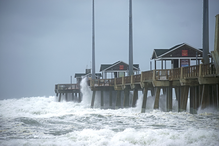 Waves washing over the deck at Jennette's Pier on Saturday. Photo, Kip Tabb