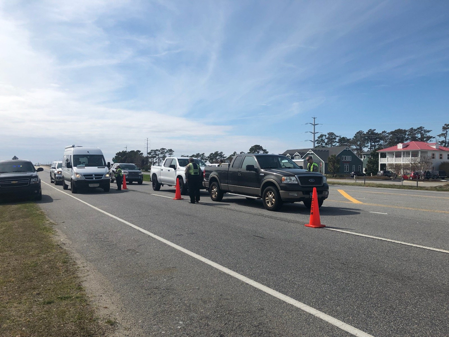 Traffic stop at the Wright Memorial Bridge insures residents only are permitted onto the Outer Banks. Image, Kari Pugh, Beach 104